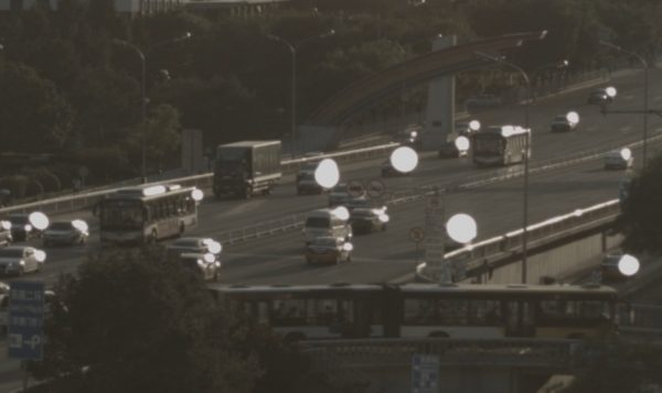 The 'White orb' effect seen on passing cars in late afternoon
