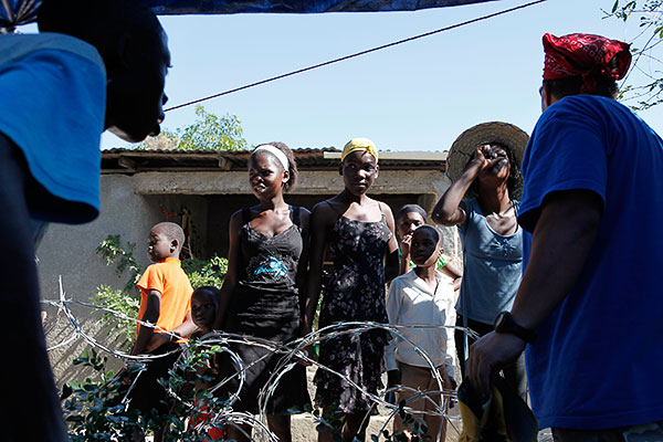 Women from the neighborhood around Rescue Children orphanage beg for water. (David Friedman / msnbc.com)