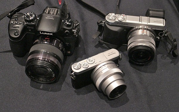 The Lumix DMC-GM1, center, is tiny compared to the GH3 at left and the GX7 at right.