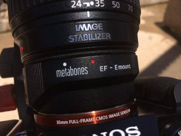 You need the latest version of the Metabones EF to E mount adapter to work with full-frame glass