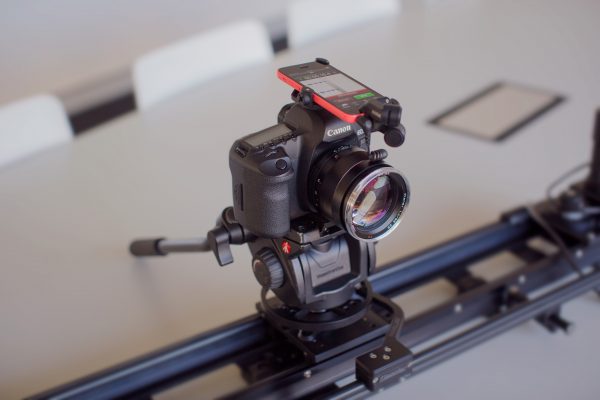 The iXY can attach to the top of your DSLR using the accessory RodeGrip