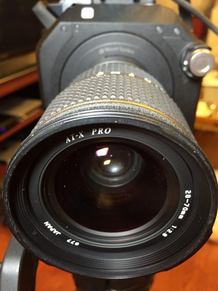 Not as good as a Zeiss, but at $100 used this very possibly the cheapest quality 28-70 f2.8 out there