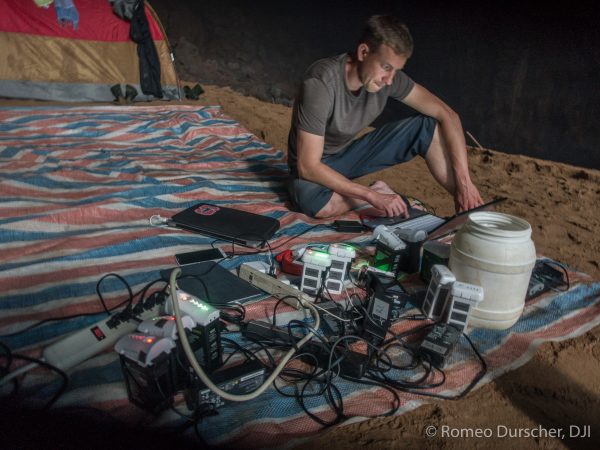 Drone pilot Ferdinand Wolf in the location charging area. And you thought you had a lot of batteries.