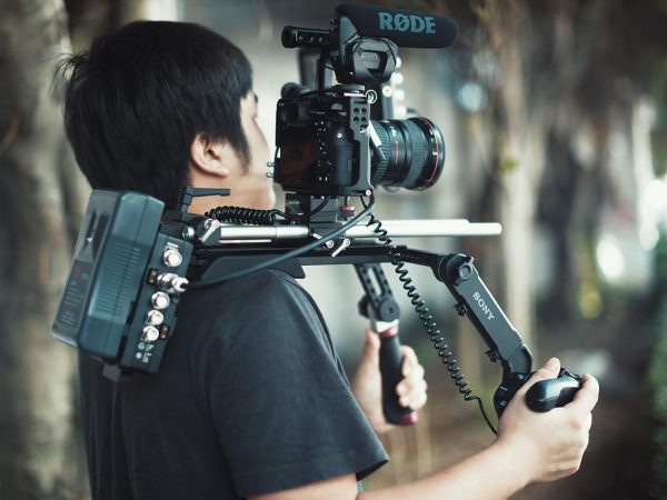 Movcam a7S lanc controller in use on a shoulder rig