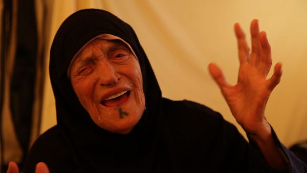 Shahira a Bedouin grandmother from Daraa cries out at the atrocities of Assad in Zaatari refugee camp