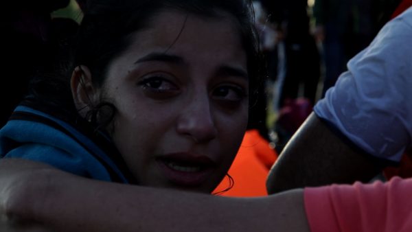 A woman from Damascus, Syria cries after having finally reached the safety of the shores of Lesvos after a frightening journey across the sea from Turkey. Photograph: Sharron Ward