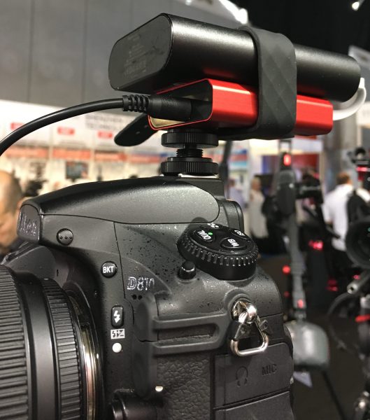 The iFootage E1 with power bank on top of a Nikon DSLR