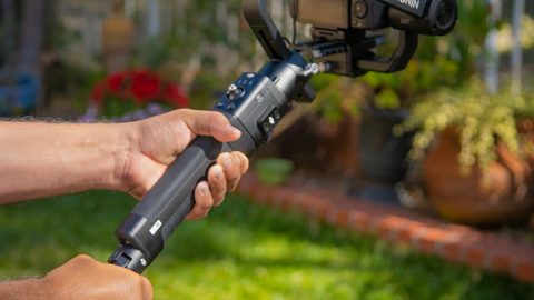 Ronin S in hand with tripod attached