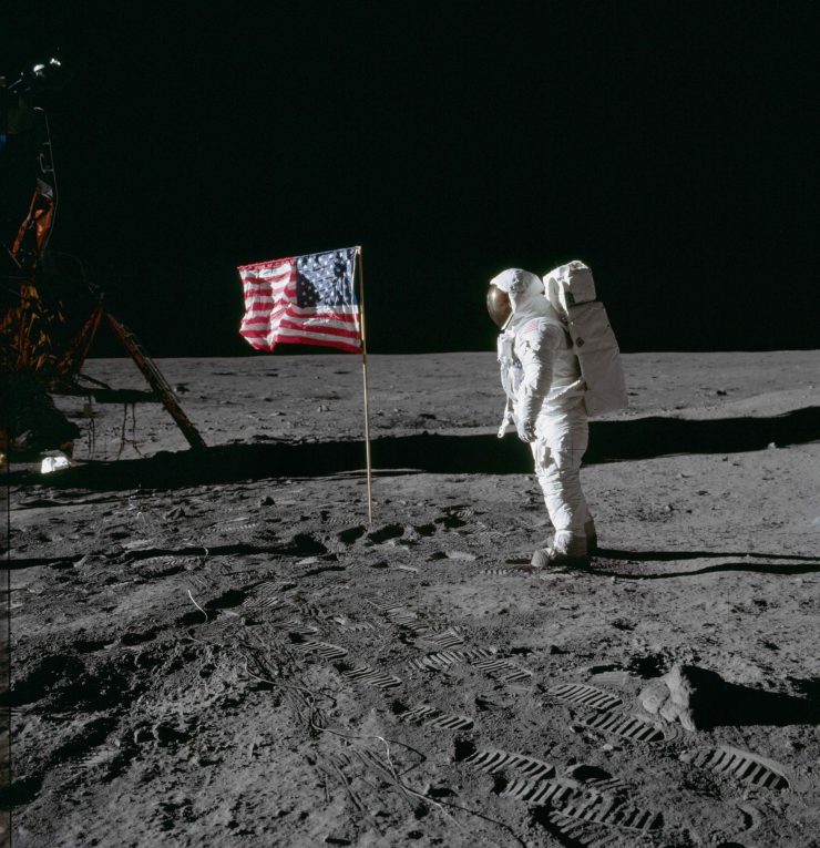 Astronaut Buzz Aldrin poses for photograph beside deployed U S flag © NASA